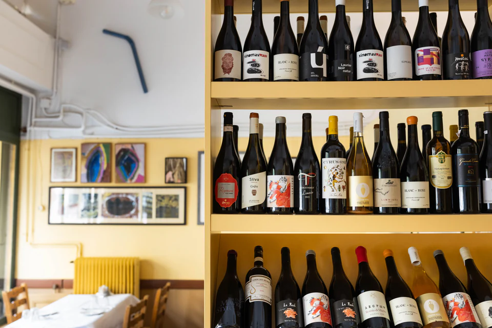 Wine shelves in the sunlit dining room
